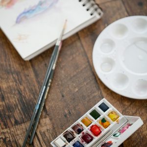 water-color-supplies-on-a-wooden-table